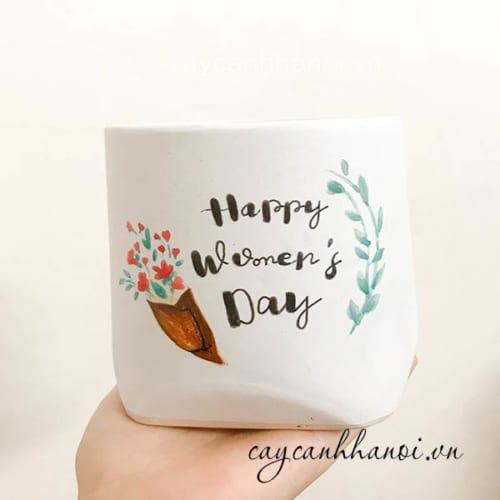 Chậu cây cảnh với slogan happy women's day